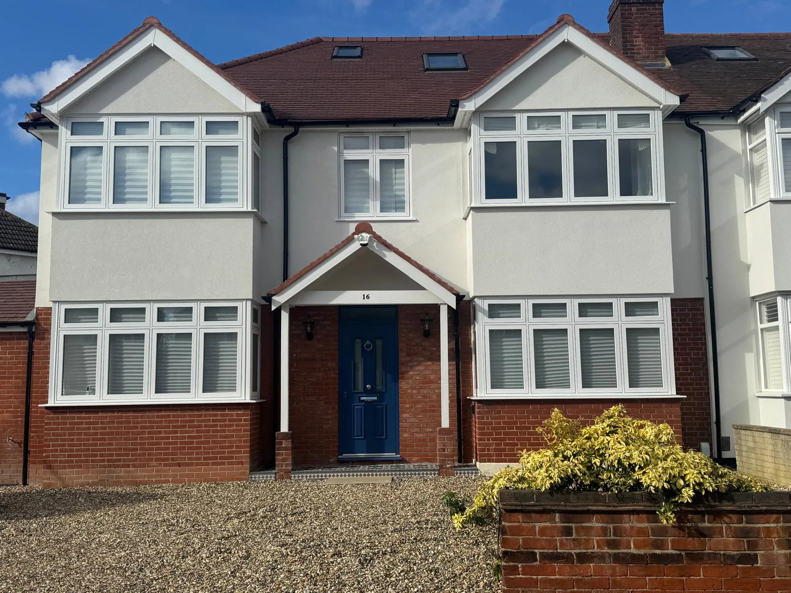 White flush casements, red brick semi