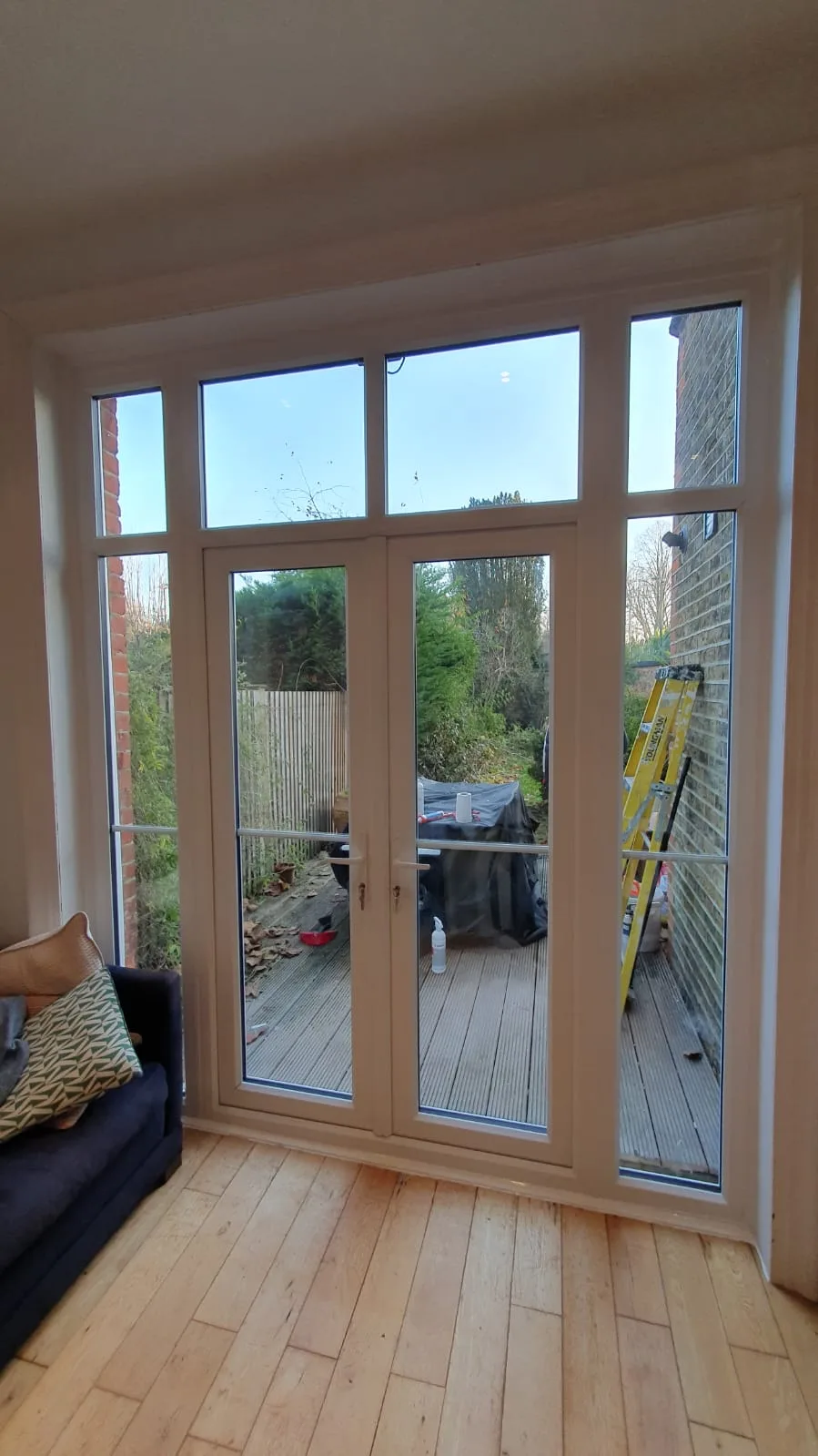 White French doors opening onto raised decking
