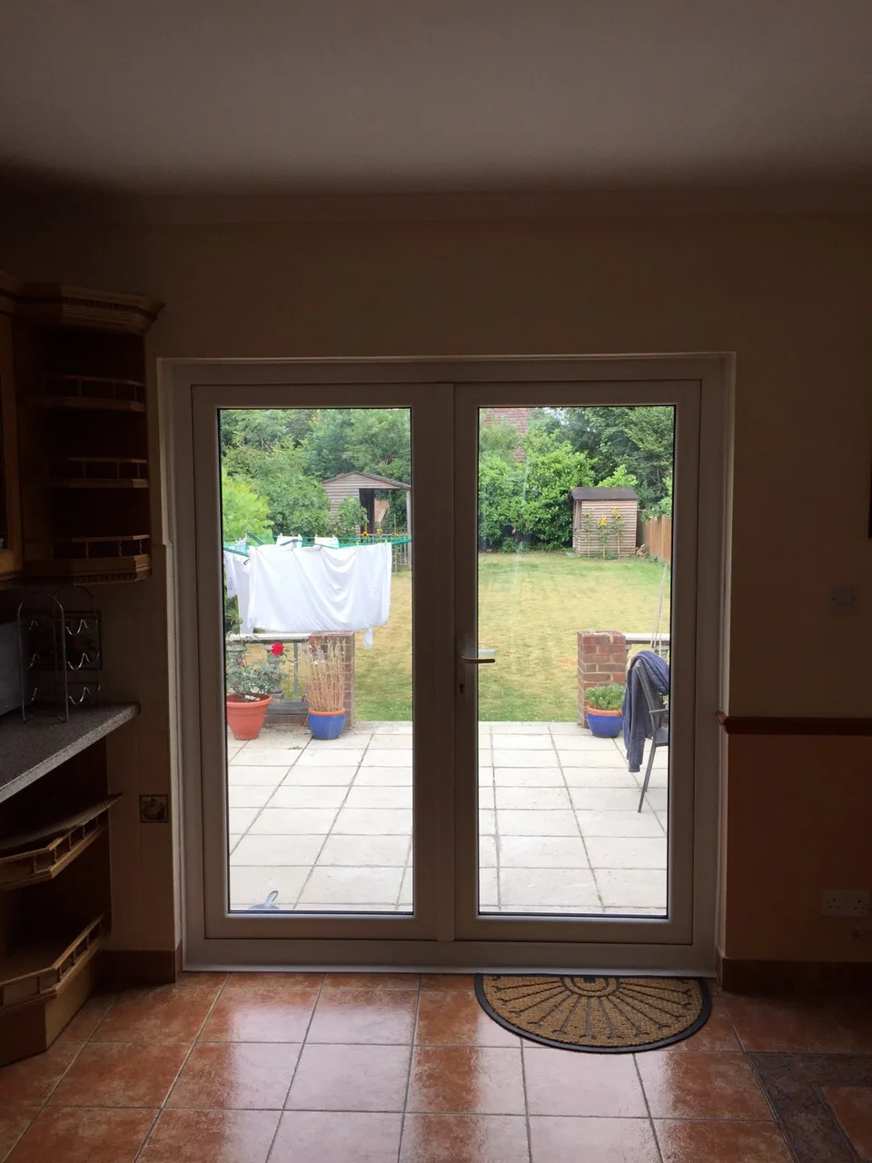 Woodgrain French doors framing the garden