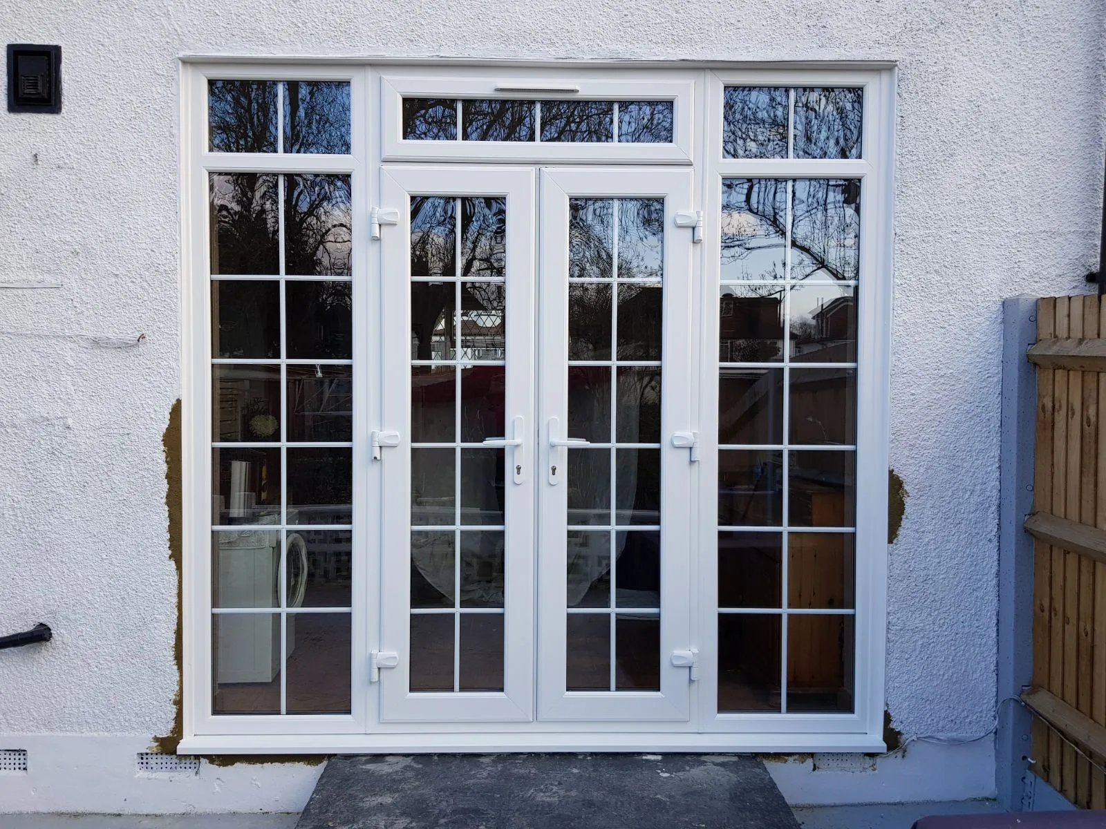 White French doors with Georgian bars and side lights