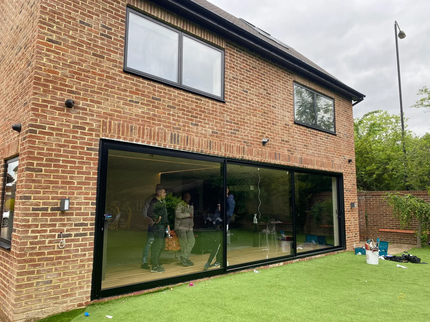 Corner glazing and sliding doors onto the lawn