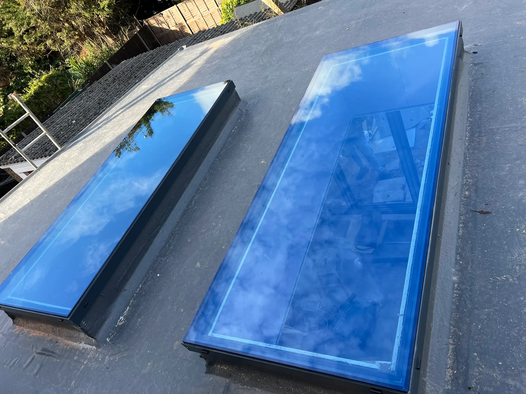 Twin slim rooflights over a flat-roof extension