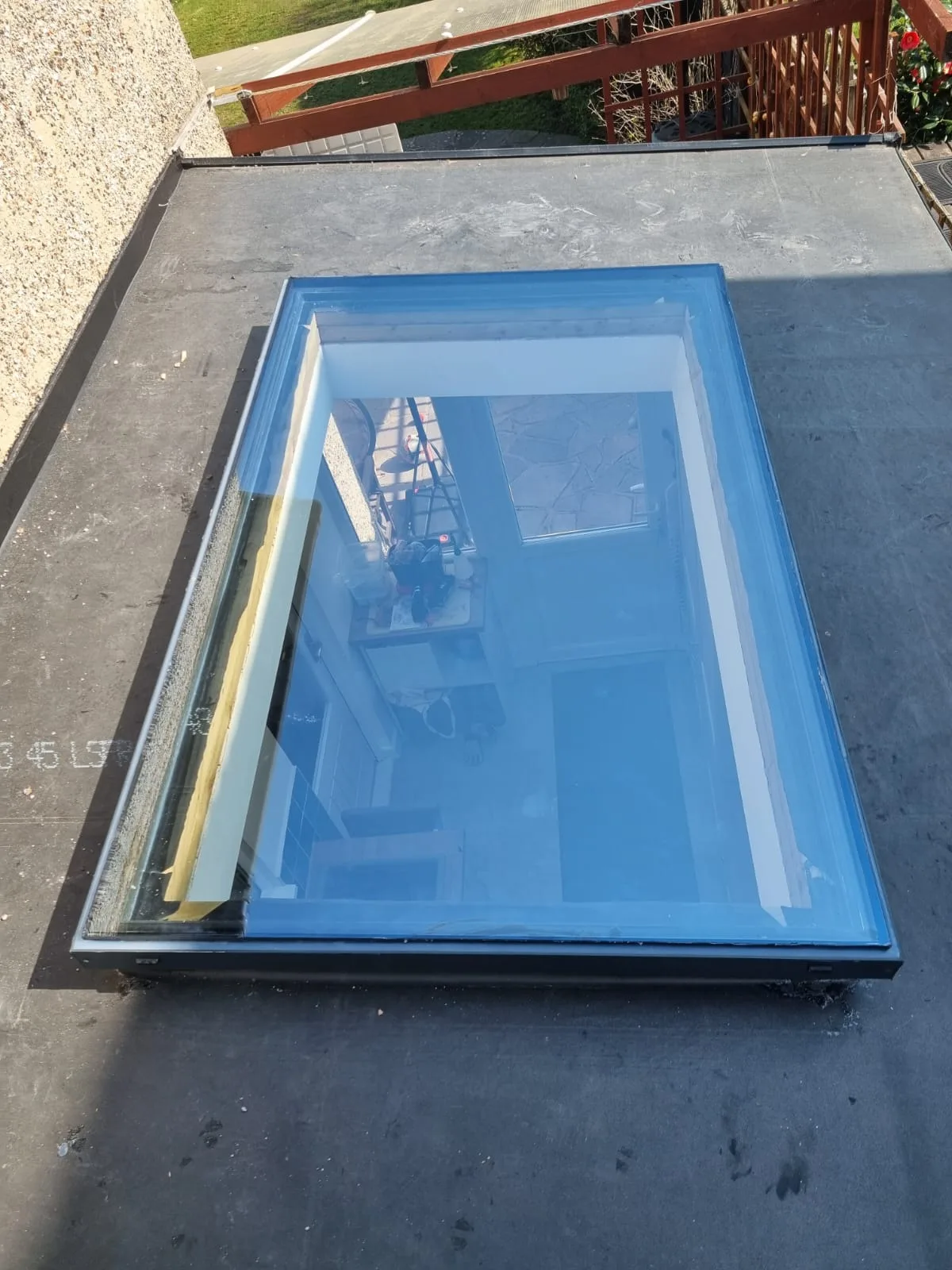 Slim rooflight set flush into a warm roof